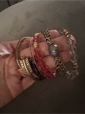 Alex and Ani gold toned Stackable Bracelets in Gold, Pink, Purple and Clear.